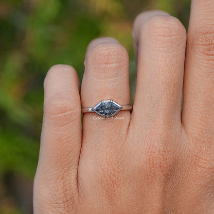 Marquise-cut gray moissanite solitaire ring on hand, side profile