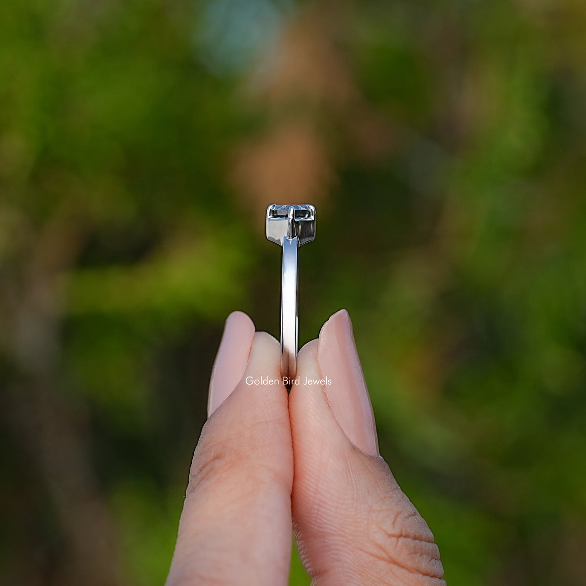Marquise solitaire ring top view with stone in square prong basket