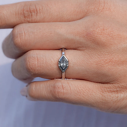 Marquise-cut gray moissanite solitaire ring, close-up side view of prongs