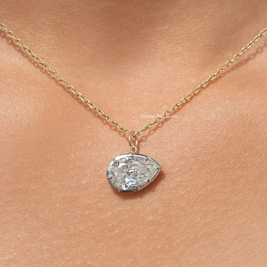 Gold-tone pear-shaped bezel solitaire pendant with moissanite stone on chain