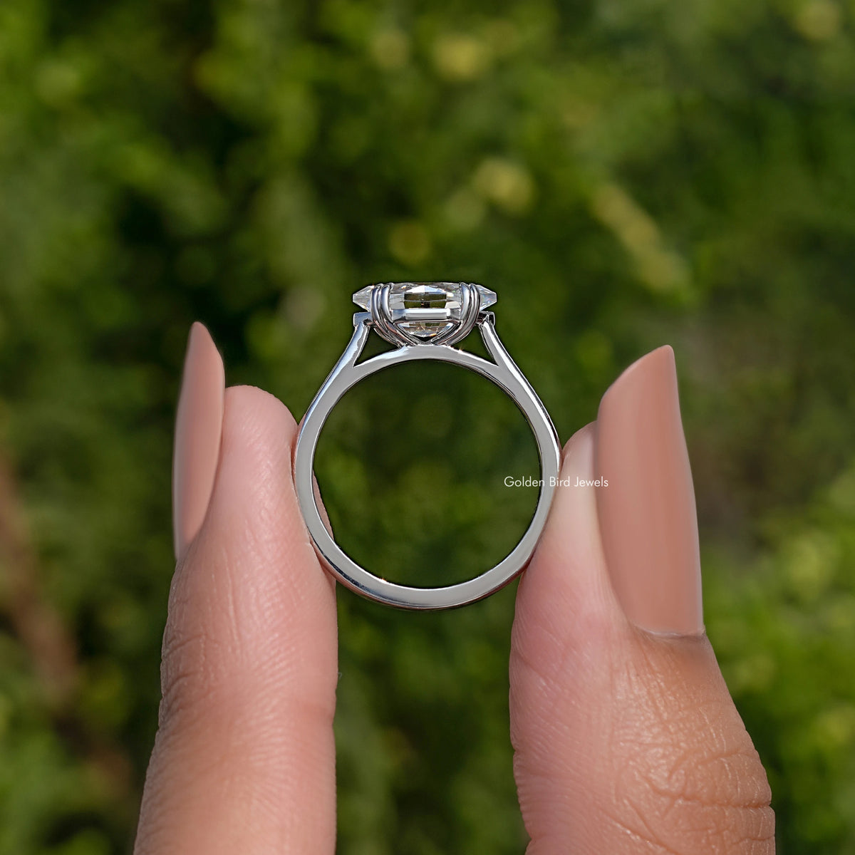 Marquise solitaire ring front view showing open prong setting and polished silver band