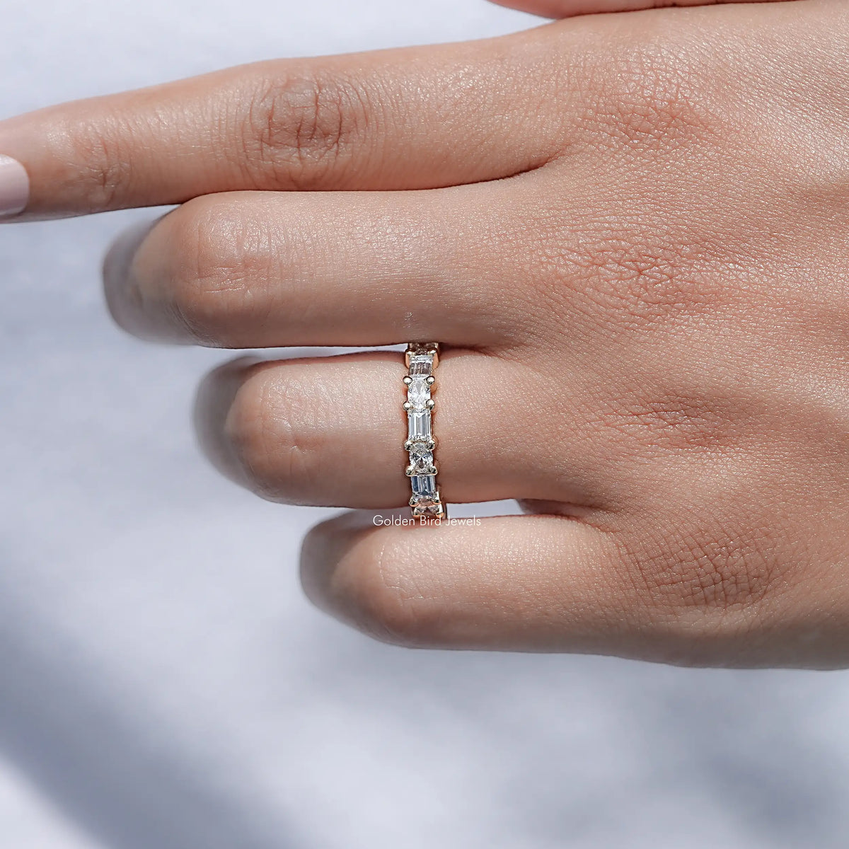 Lab diamond baguette band ring with rectangular stones in gold-toned metal