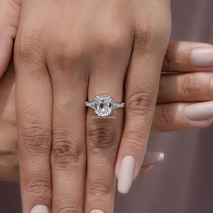 Vintage elongated cushion solitaire ring with pavé band on hand