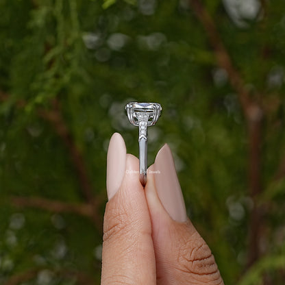 Elongated cushion solitaire ring showing center stone and prong setting, top view