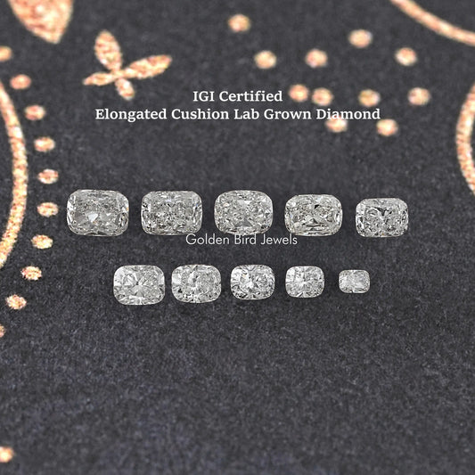 IGI certified elongated cushion lab-grown diamonds, loose assortment on dark felt.
