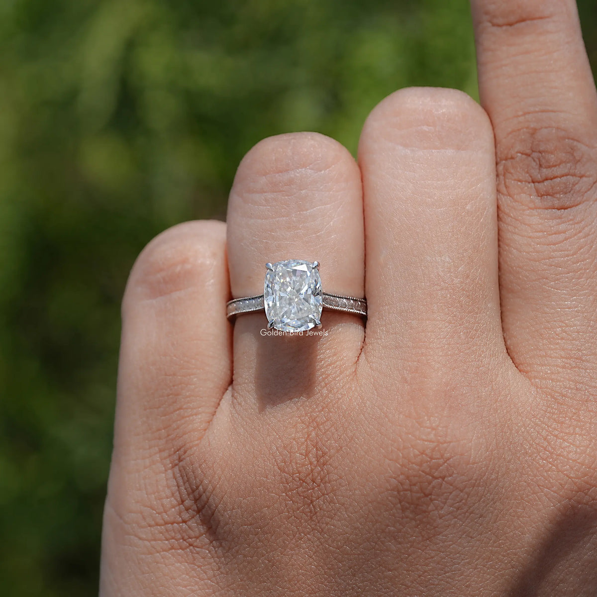 In finger view of Elongated Cushion Cut Solitaire Ring