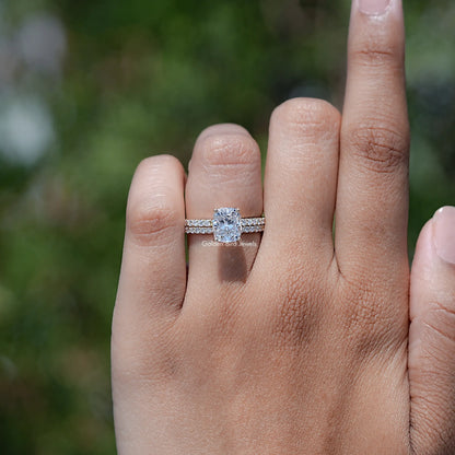 Elongated cushion cut lab grown diamond ring with pavé band on finger
