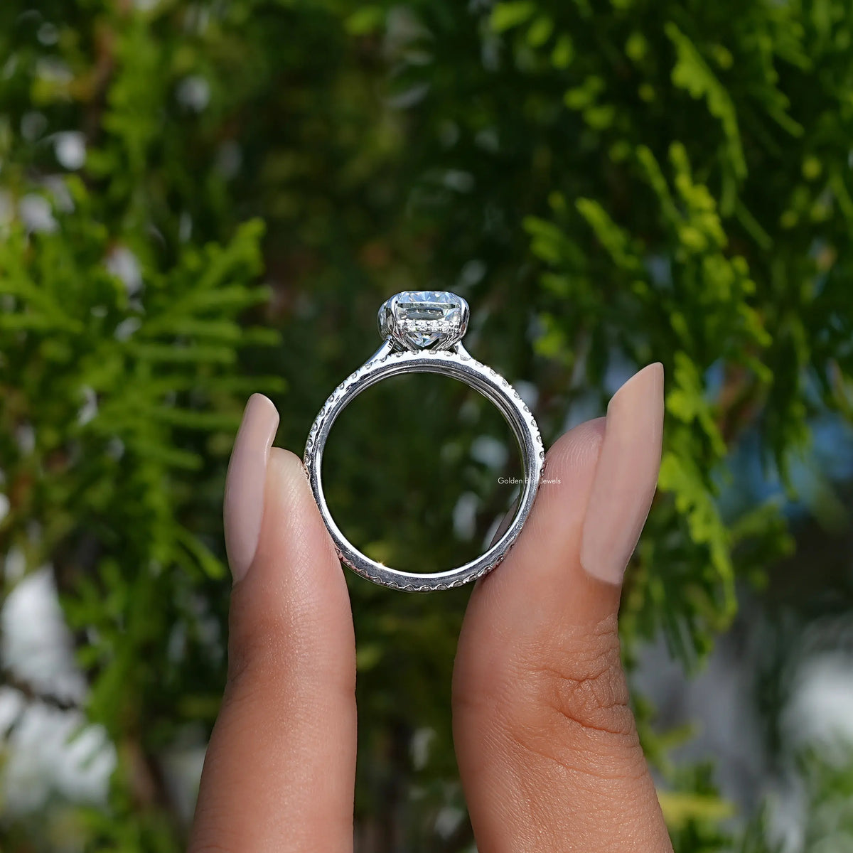 Silver-tone ring with elongated cushion moissanite center and square halo top