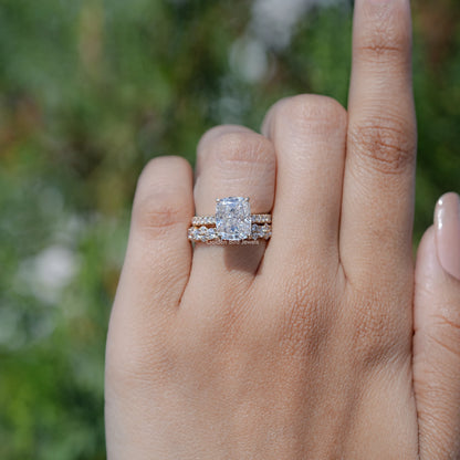 Moissanite ring set with elongated cushion cut center stone