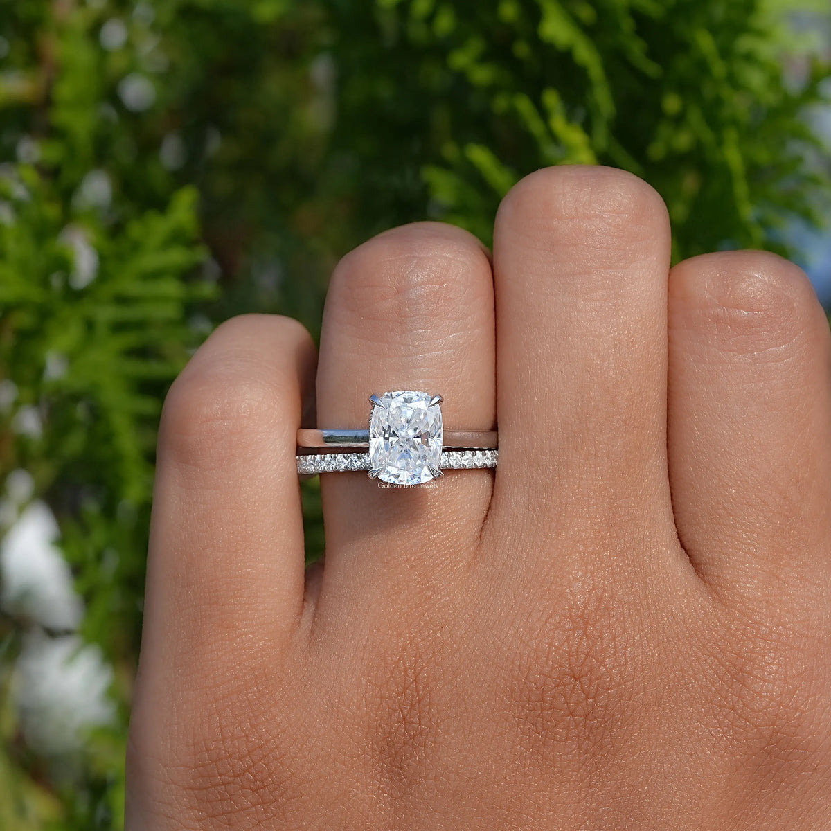 Elongated cushion moissanite ring with slim pave band and centered square stone