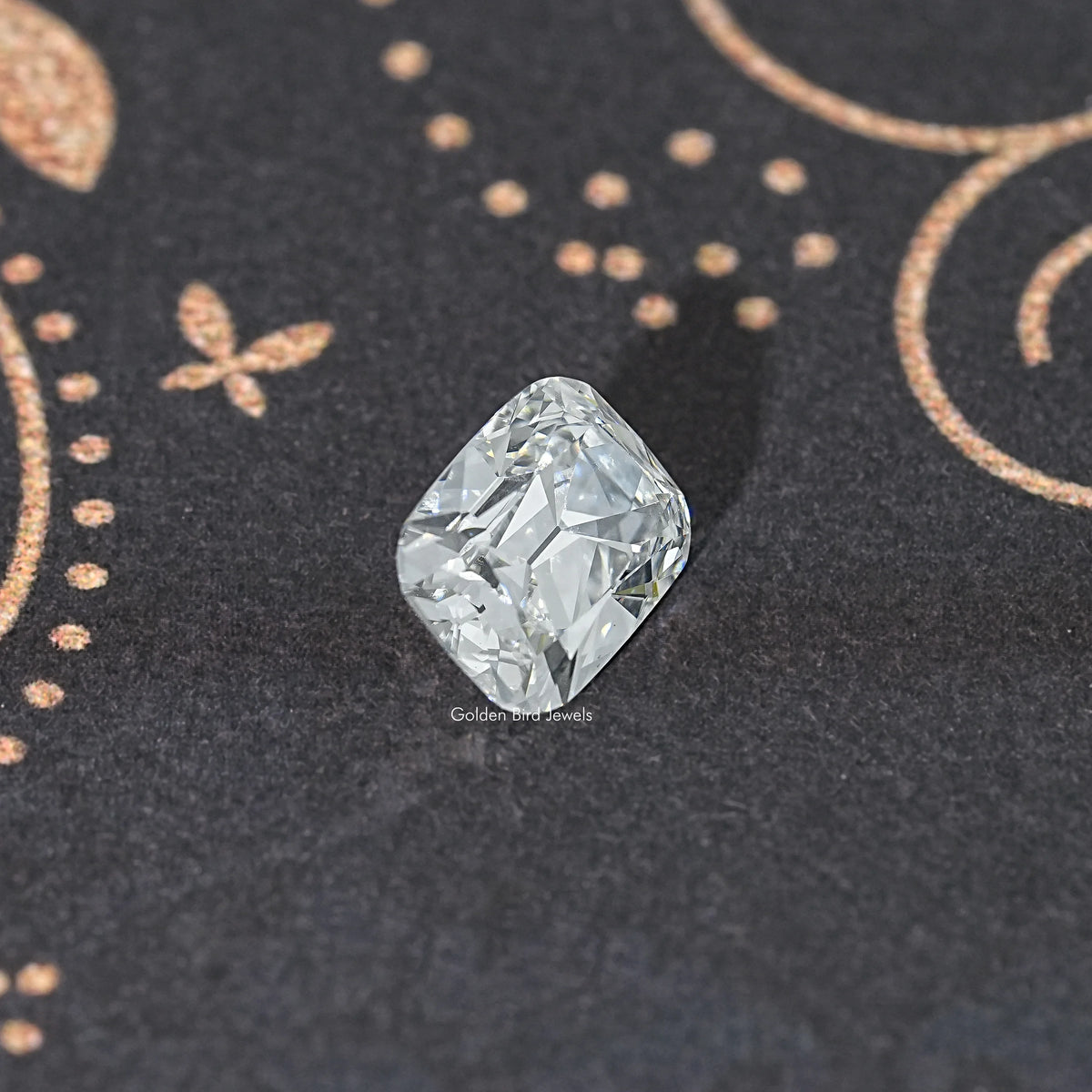 Elongated old mine cushion lab-grown diamond, top view on dark surface