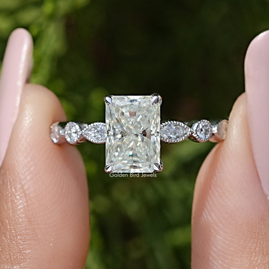 Radiant cut moissanite engagement ring close-up, square center with two round side stones