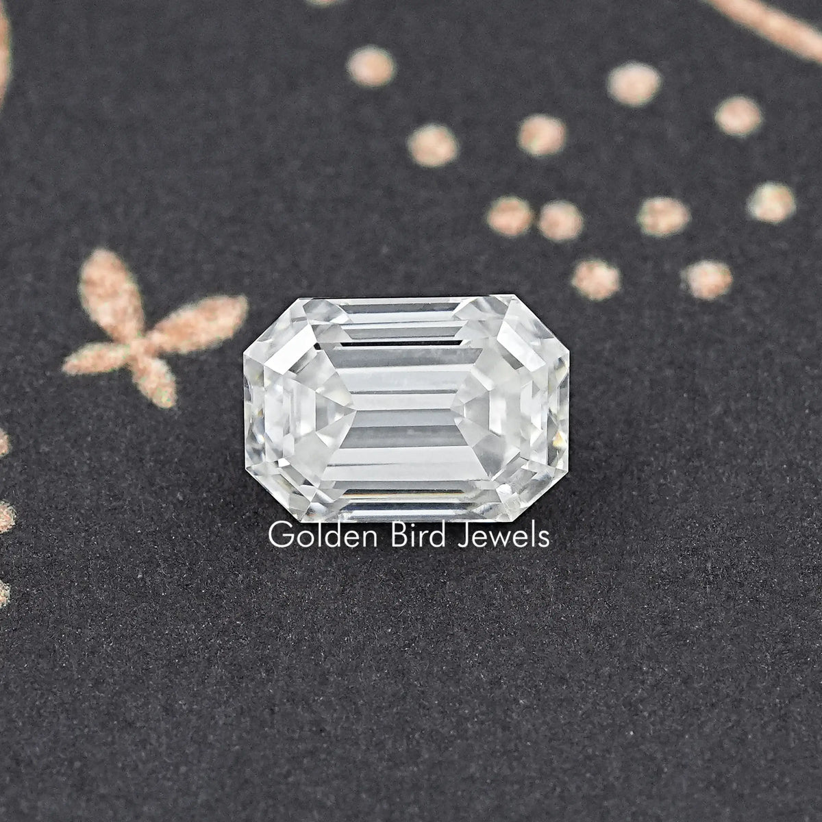 Loose emerald-cut moissanite gemstone, clear step-cut facets, polished edges