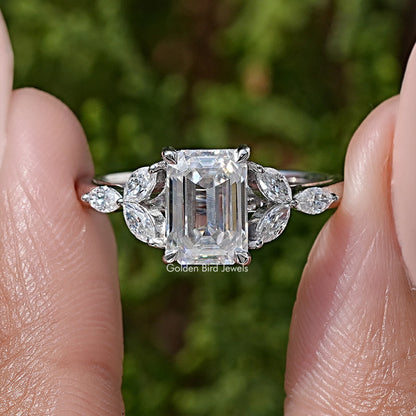925 silver moissanite ring close-up: emerald-cut center with marquise side stones