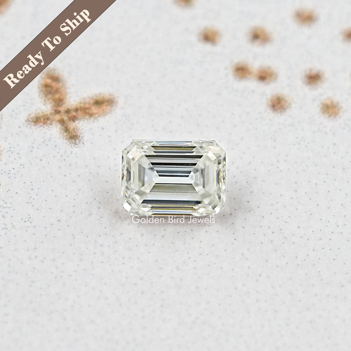 Emerald-cut moissanite loose stone with crisp step-cut facets