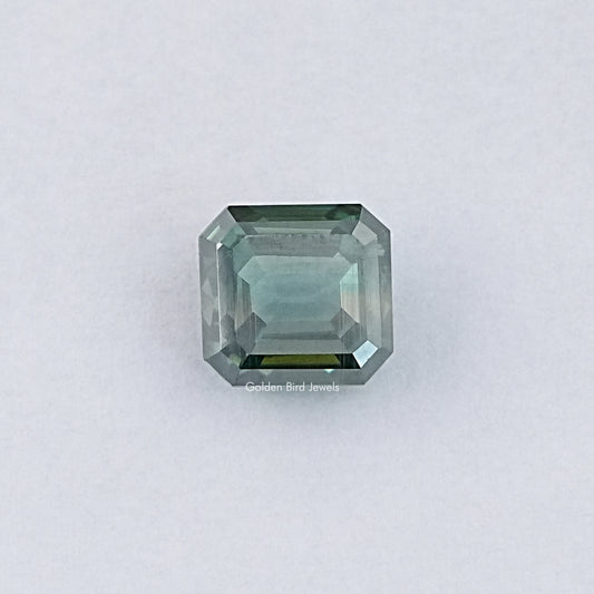Green emerald-cut loose moissanite gemstone, light green step-cut facets