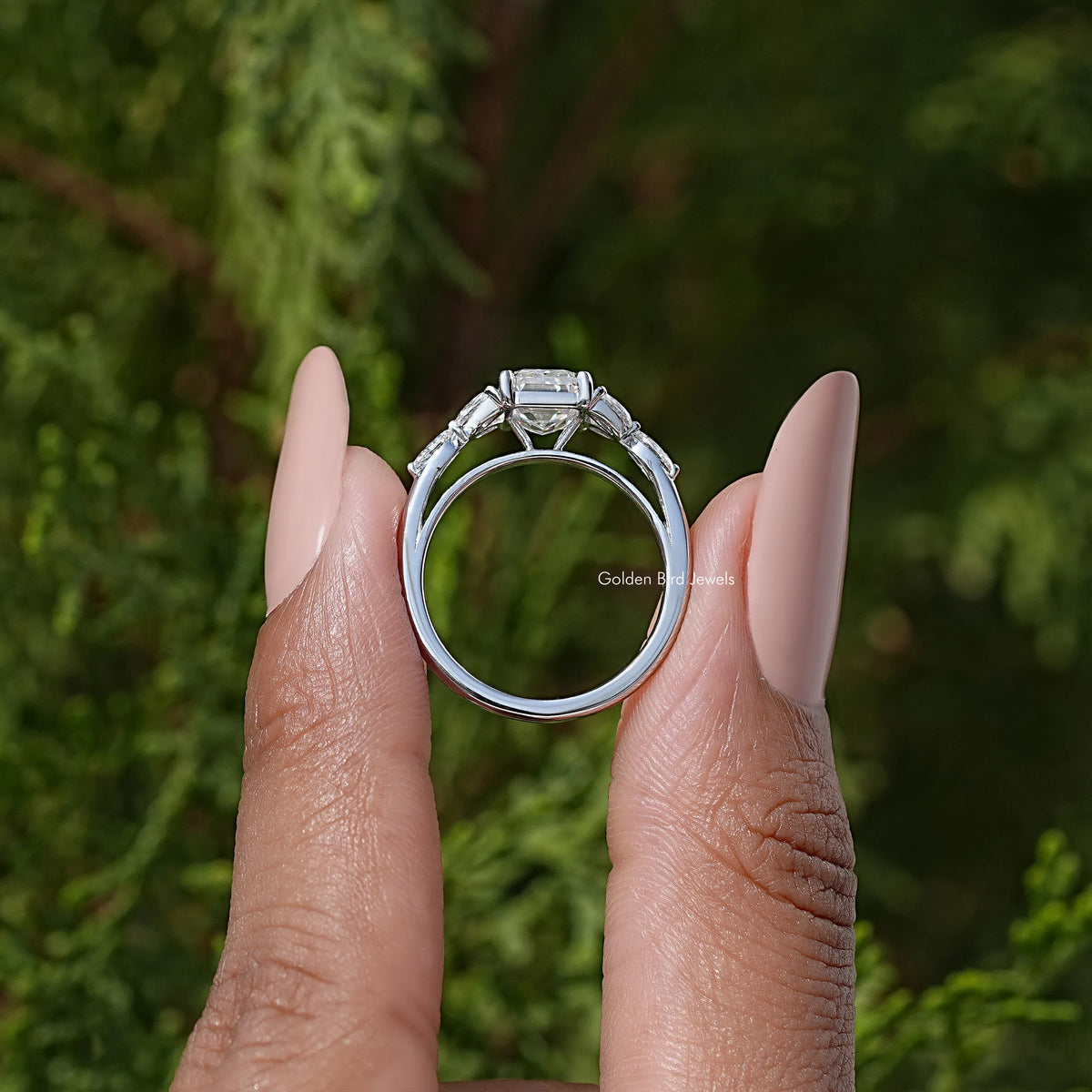 925 silver moissanite ring with emerald-cut center stone and prong setting