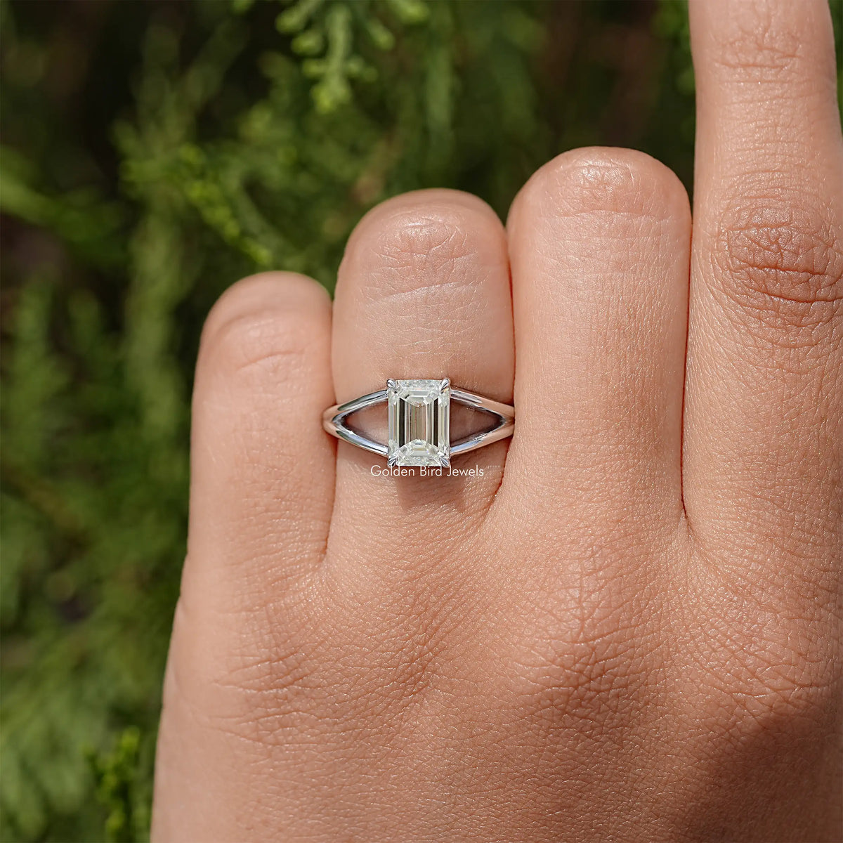 Sterling silver split-shank ring with emerald-cut center stone