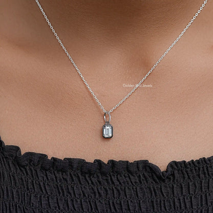 Silver chain necklace featuring small rectangular bezel-set solitaire pendant