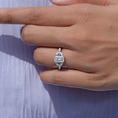 925 silver moissanite ring with emerald-cut center stone, angled profile view