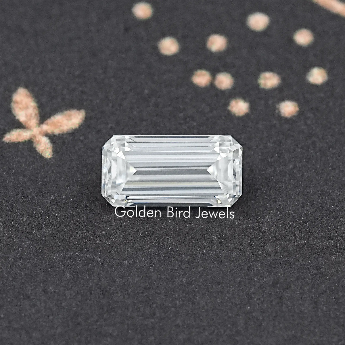Emerald-cut moissanite loose stone, clear with crisp step facets.