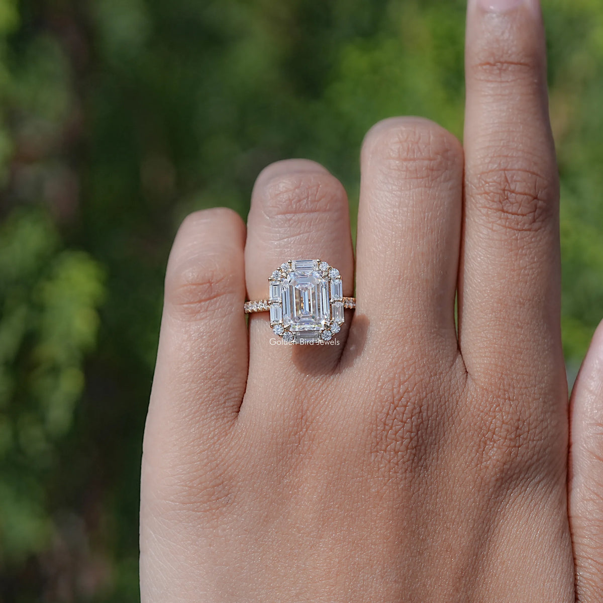 Emerald-cut halo moissanite engagement ring with square center stone, angled view