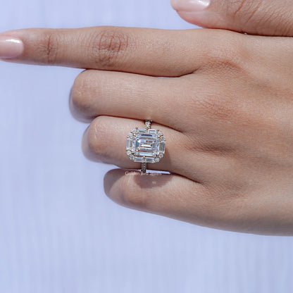 Emerald-cut halo moissanite engagement ring with square centerpiece and prong setting