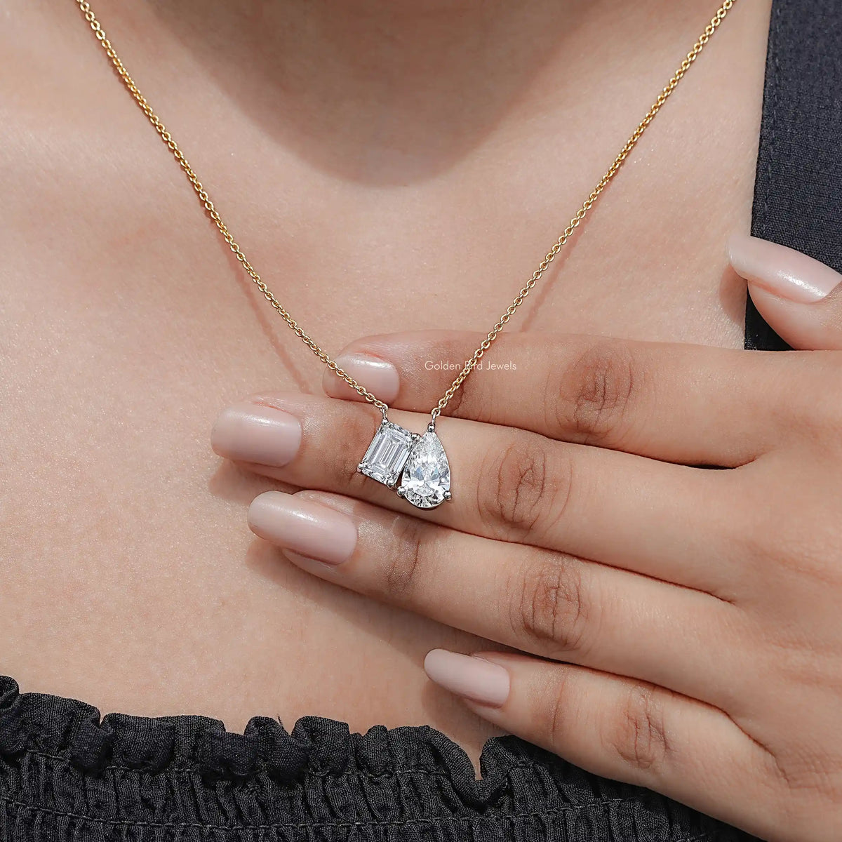 Gold two-stone pendant necklace with lab diamond baguette and pear-cut stones