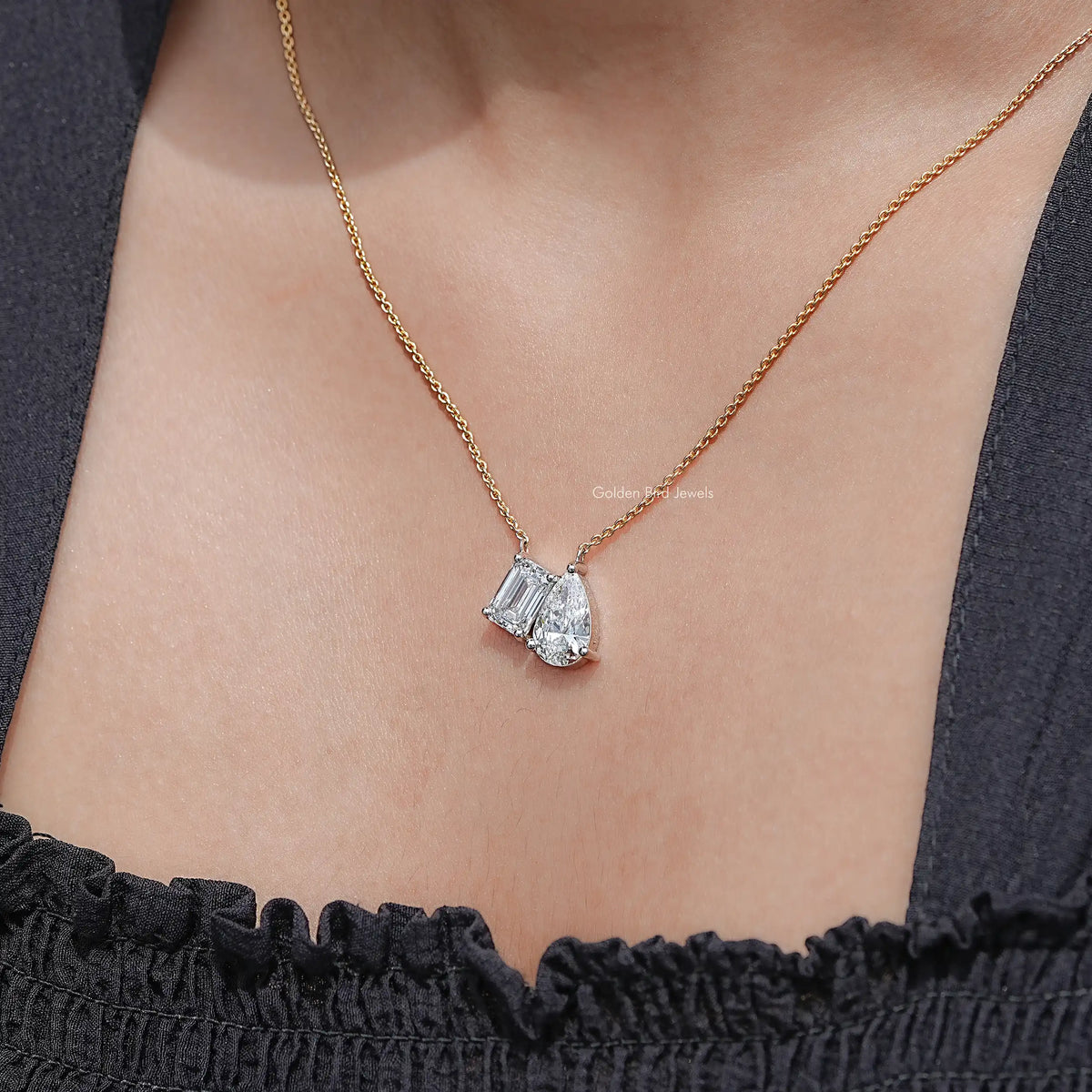 Gold two-stone lab diamond pendant necklace, baguette and pear-cut stones