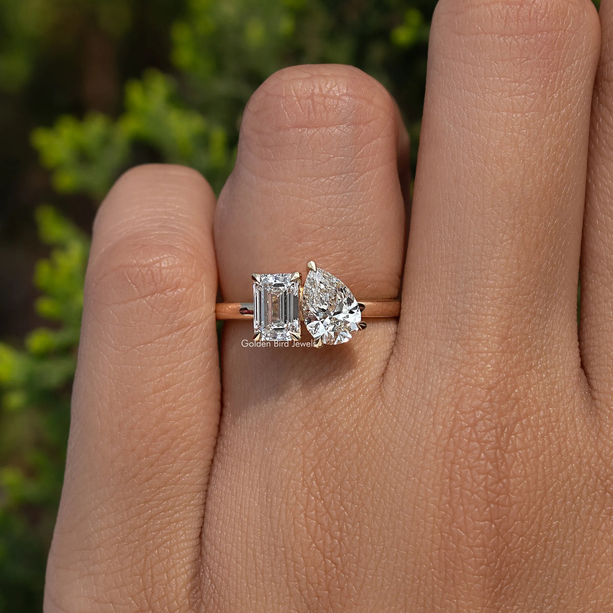 View of Emerald And Pear Cut Lab Diamond Engagement Ring In Finger