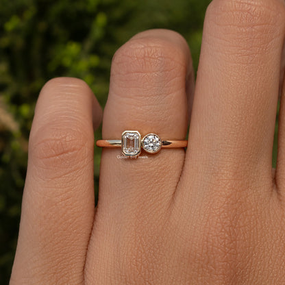 Gold-tone toi et moi ring with round and emerald-cut lab diamonds on a slim band