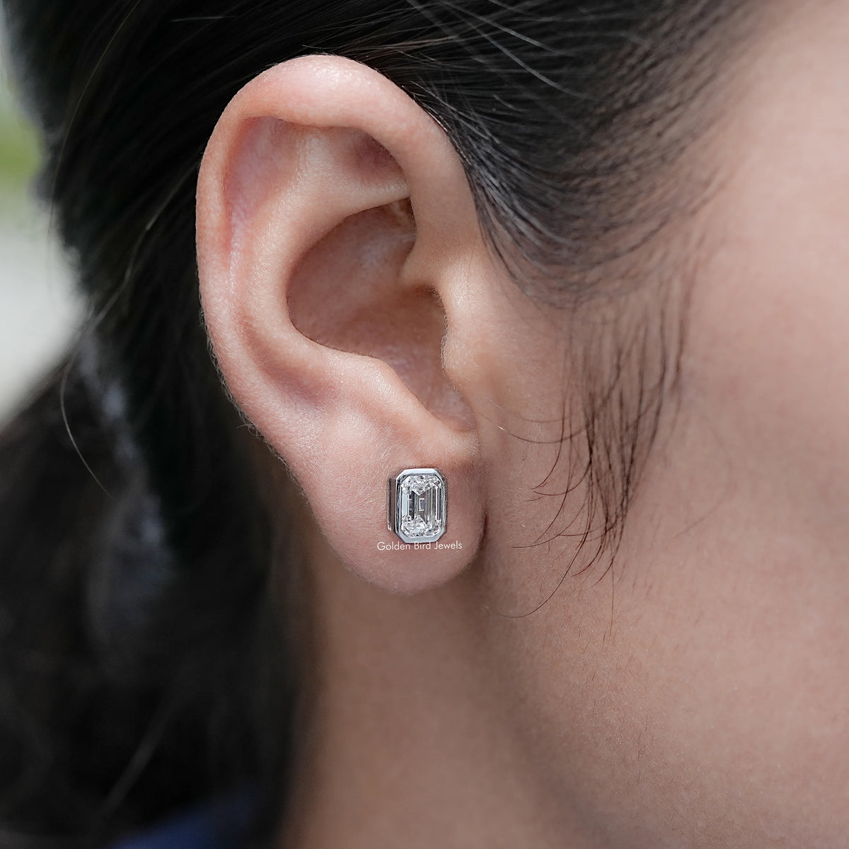 Side View of Emerald Cut Lab Diamond Stud Earrings On Ear