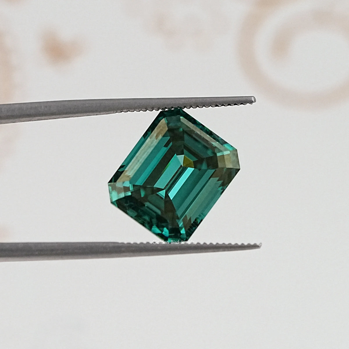 In Tweezer View Of Old Mine Emerald Cut Loose Moissanite Stone