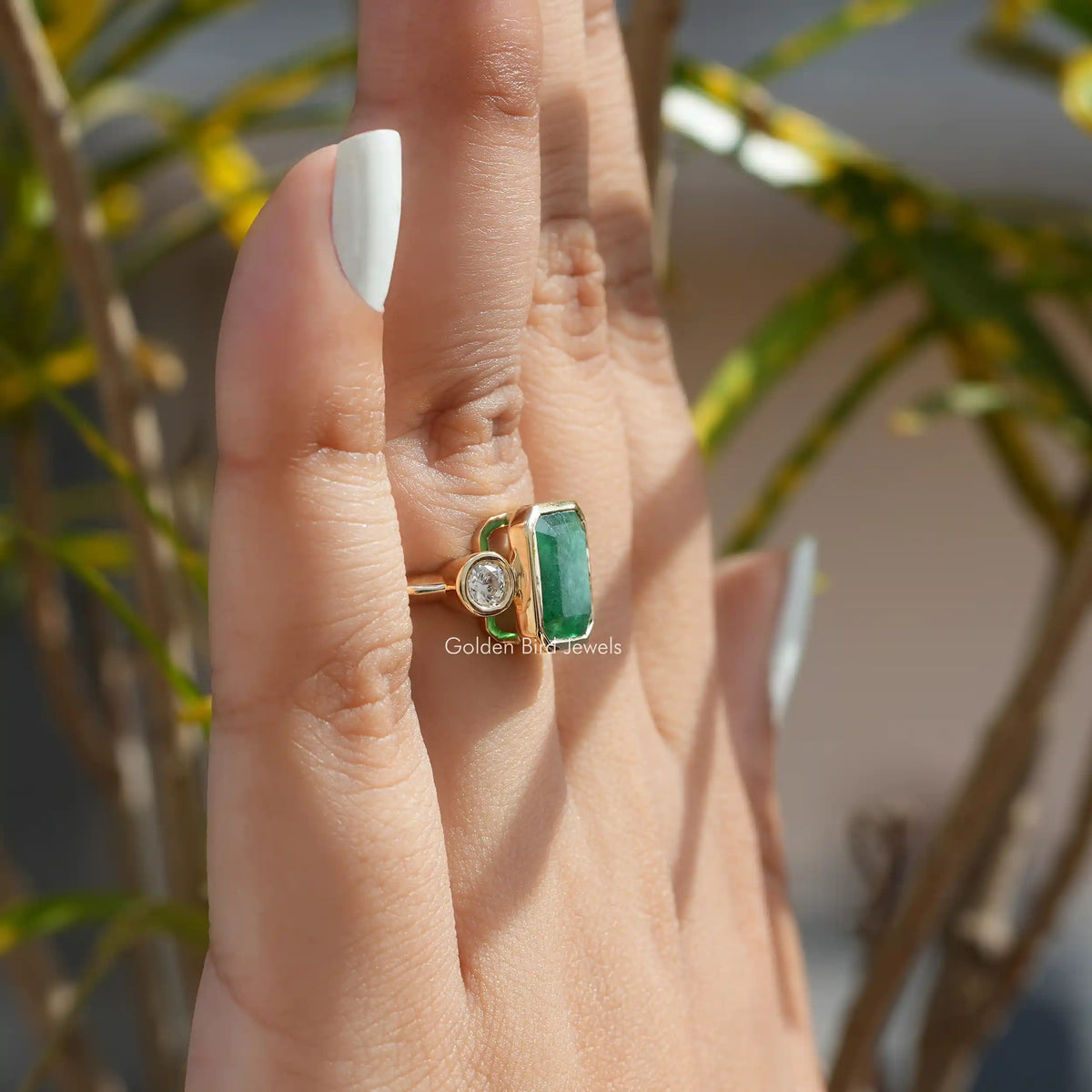 Detailed View Of Emerald Cut Moissanite 3 Stone Engagement Ring In Yellow Gold