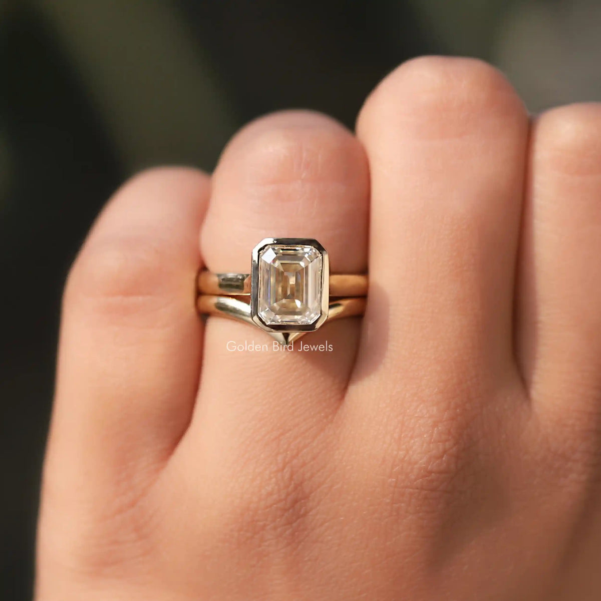 View of Emerald Cut Moissanite Curved Band In Finger