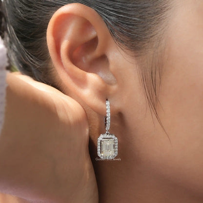 Silver emerald-cut halo drop earrings with dangling square center stone