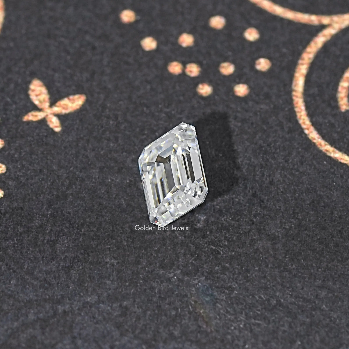 Loose emerald-cut moissanite stone, clear, three-quarter view