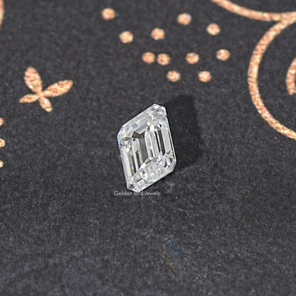Loose emerald-cut moissanite stone, clear, three-quarter view