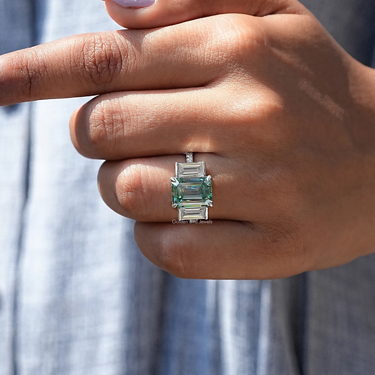 Profile View of Emerald Cut Three Stone Engagement Ring