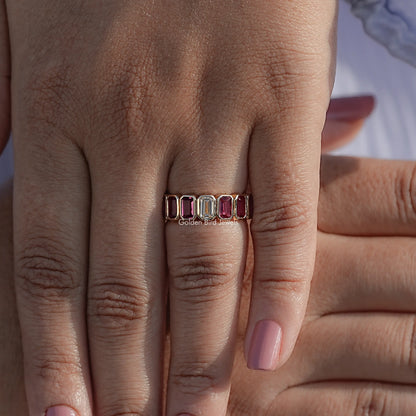Bezel-set gemstone eternity ring with rectangular stones on hand, front view