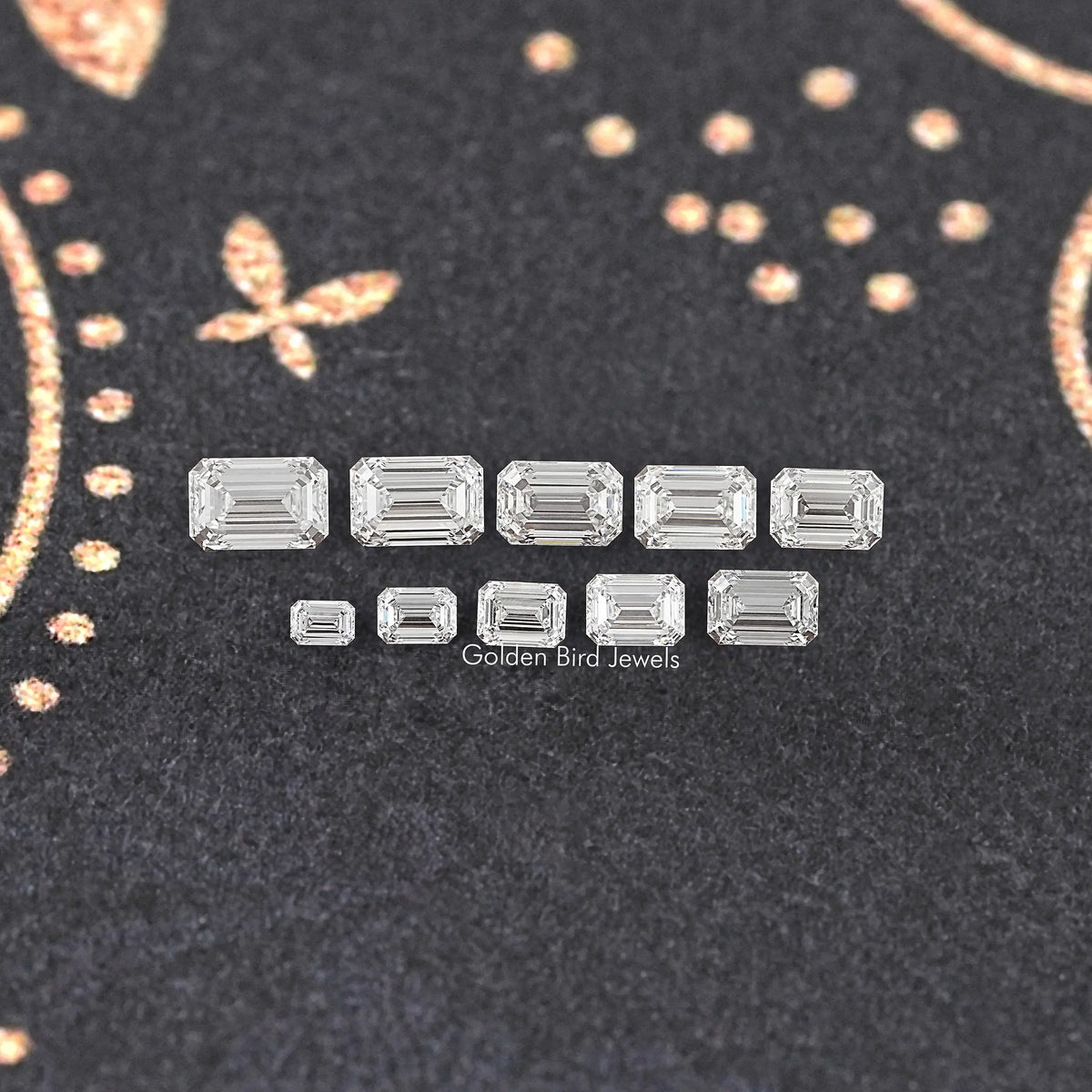 Loose emerald-cut lab-grown diamond set, shown in a neat row of stones