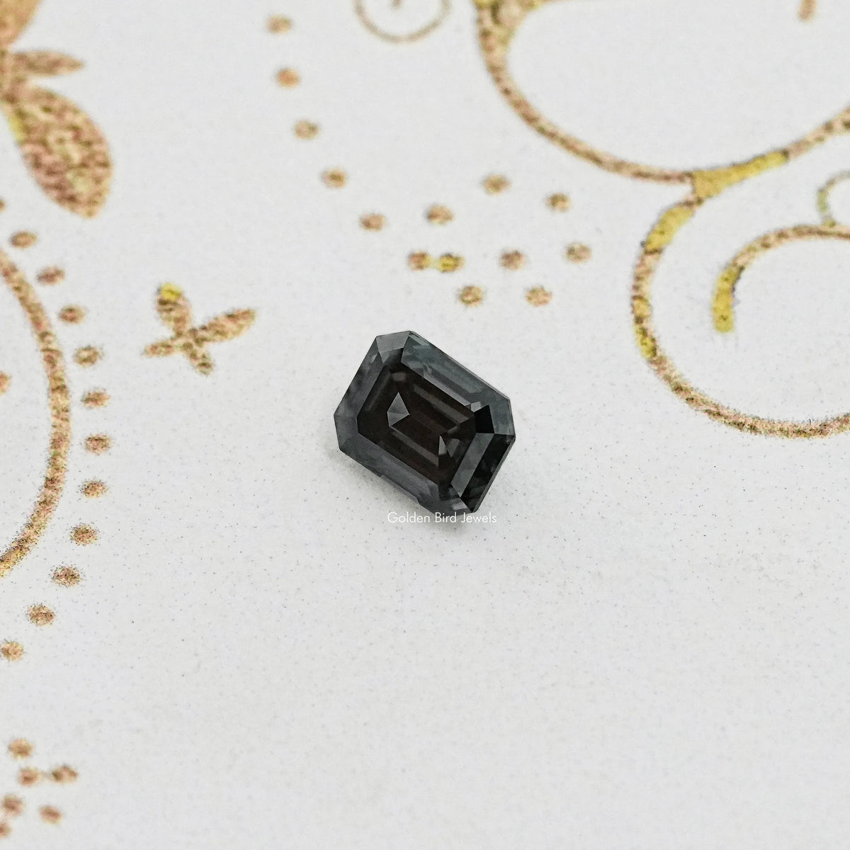 Loose dark gray emerald-cut moissanite gemstone, faceted
