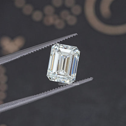 Loose emerald-cut moissanite stone, clear with crisp step facets