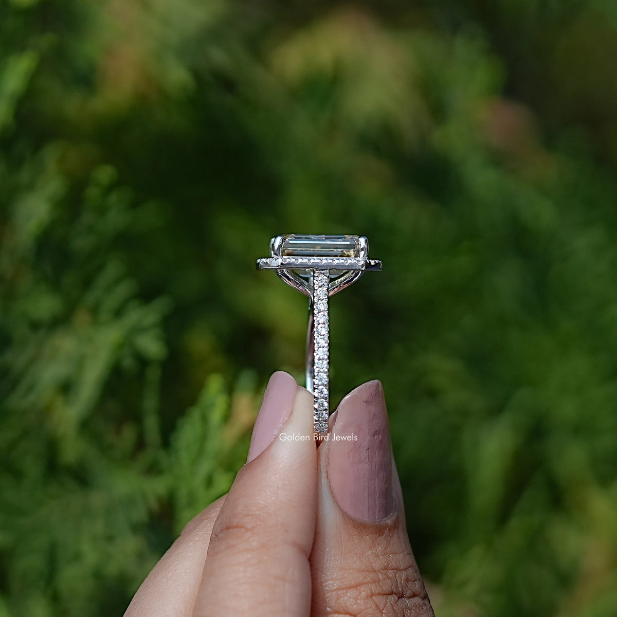 Side View of Engagement ring crafted With Emerald Cut moissanite 
