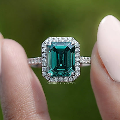 Halo emerald-cut green moissanite ring with diamond accents, sterling silver