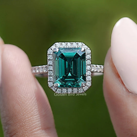 Halo emerald-cut green moissanite ring with diamond accents, sterling silver