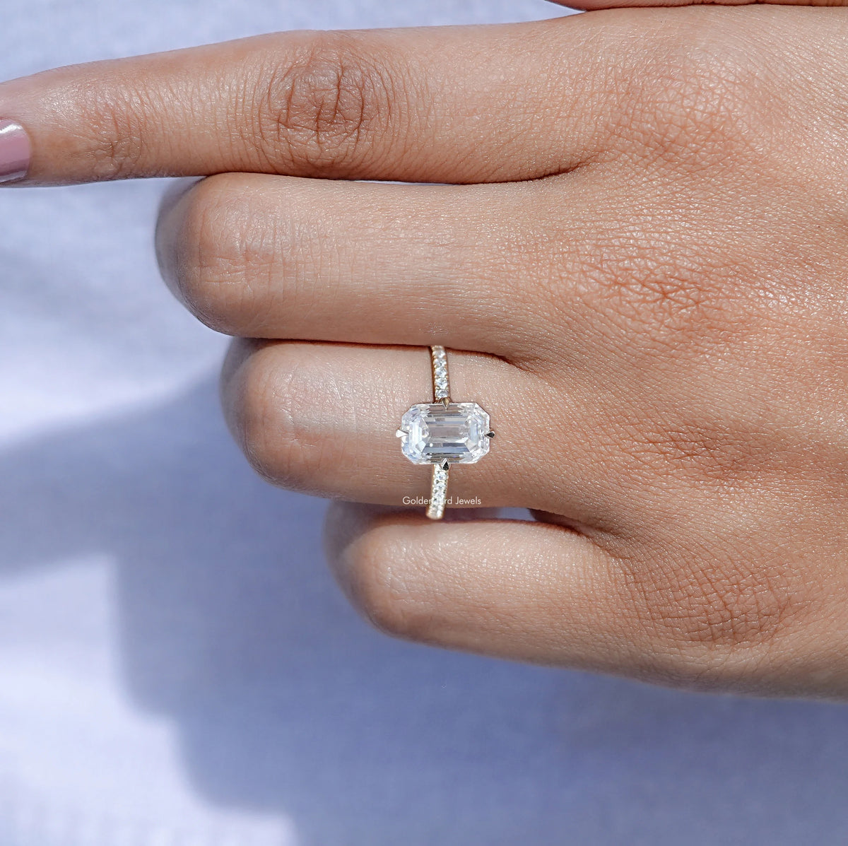 View of Emerald Cut Moissanite Engagement Ring in prongs setting 