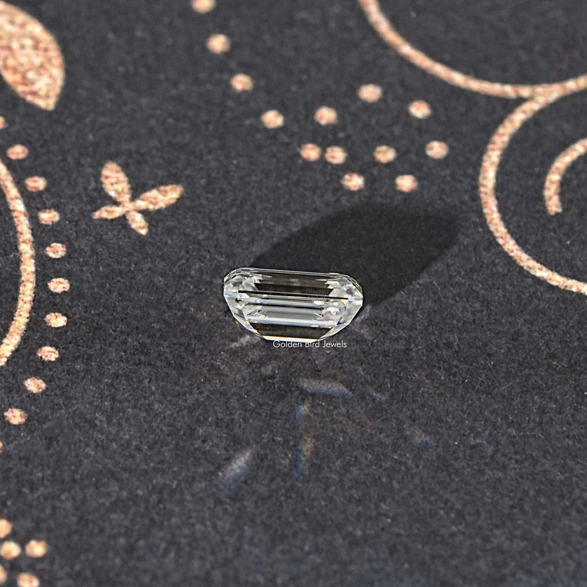 Near colorless emerald-cut moissanite loose stone, rectangular with faceted edges
