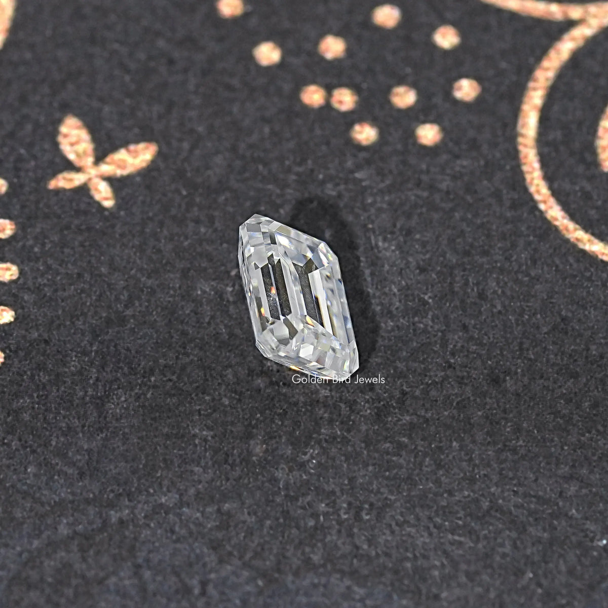 Loose emerald-cut moissanite stone, clear step-cut shape
