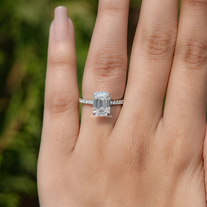 In finger view of Emerald Cut Moissanite Solitaire Ring